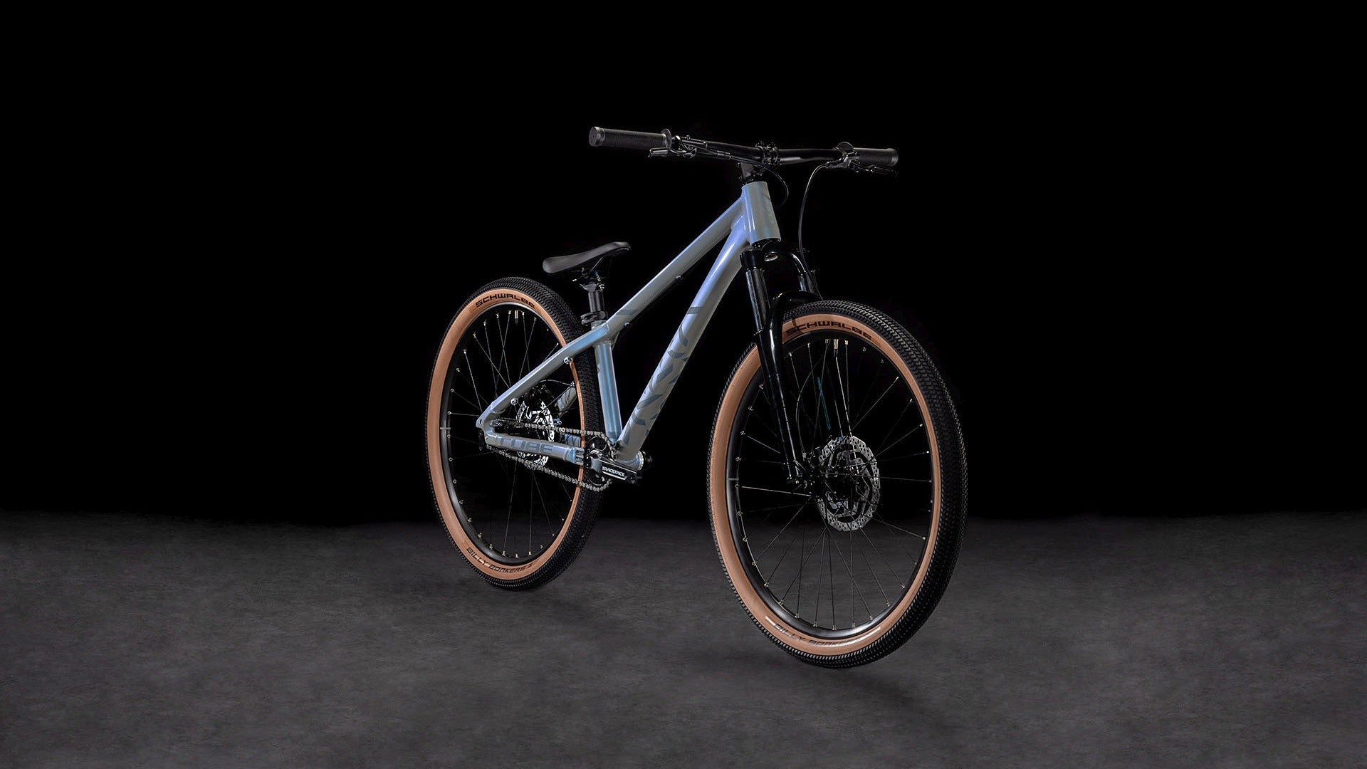 Light blue Dirt Jump Bike on a dark background