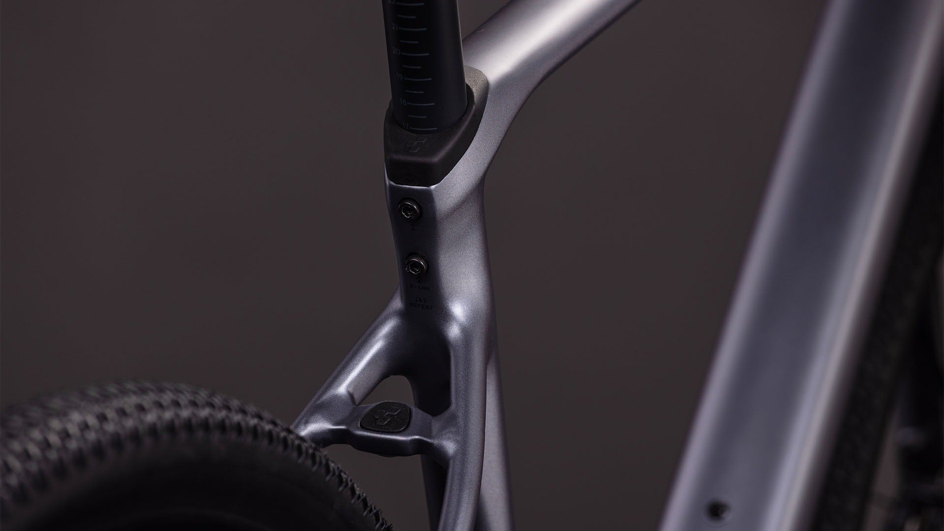 Close-up of a bicycle frame with a dark background