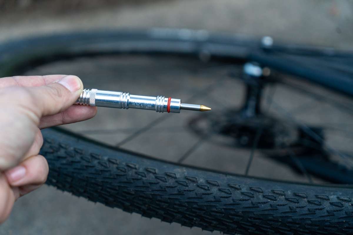 A picture of the silver Dynaplug Racer Pro Tubeless Repair Kit ready to be used