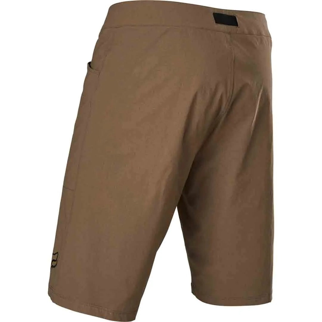 Tan mountain bike shorts on a white background