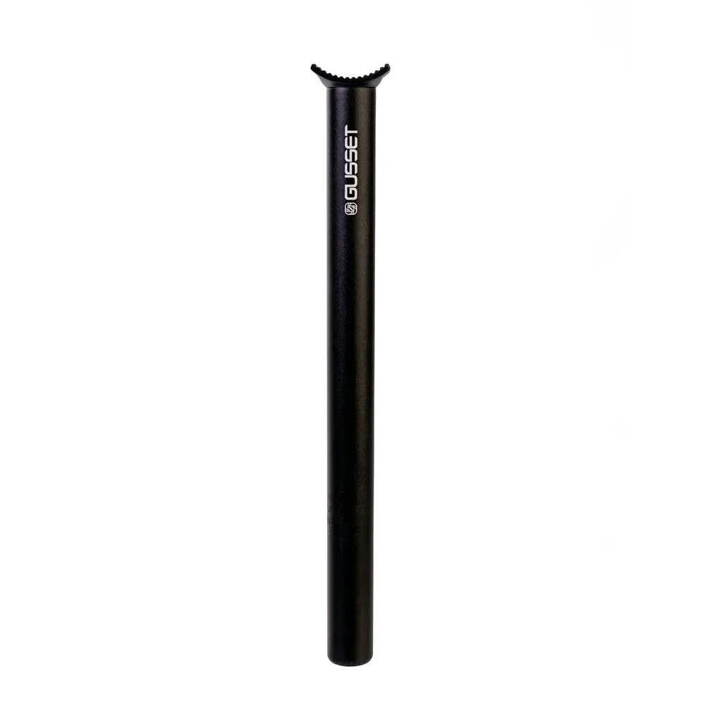 A black bicycle seat post with white vertical branding text reading 'GUSSET' near the top, shown against a plain white background.