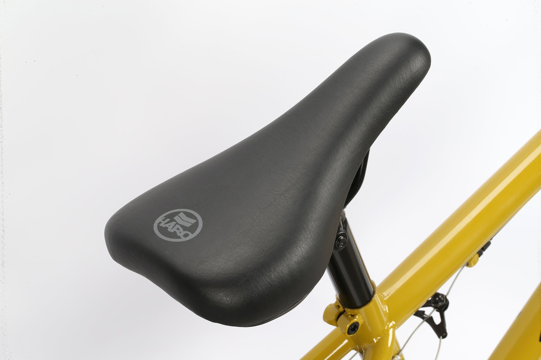 A picture of the saddle of the Haro Leucadia BMX Bicycle Honey Mustard