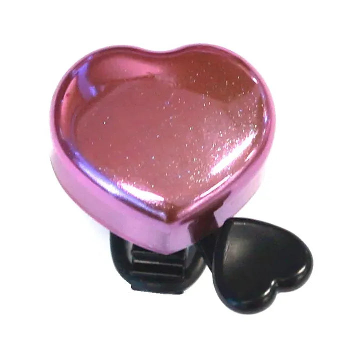 Heart-shaped pink bicycle bell with a black clip on a white background