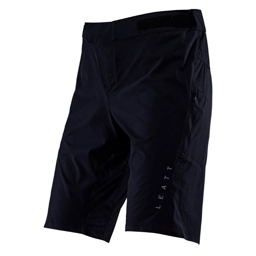 Black Leatt mountain bike shorts with a brand logo on a white background