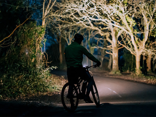 A picture of the MagicShine ME 1000 E-Bike Light beam shining from a bike in the dark