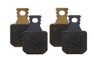 Four bicycle disc brake pads on a white background