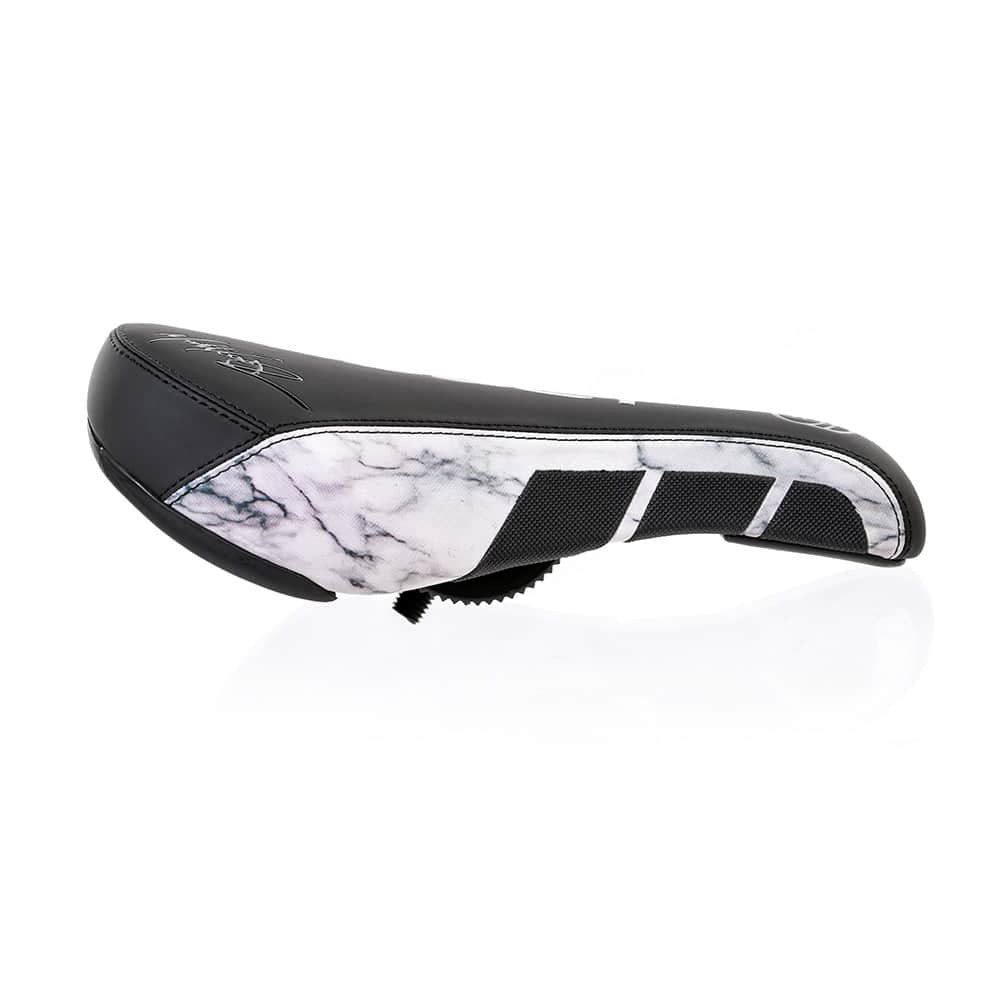 Saddle with a marbled white and black pattern on the side on white background