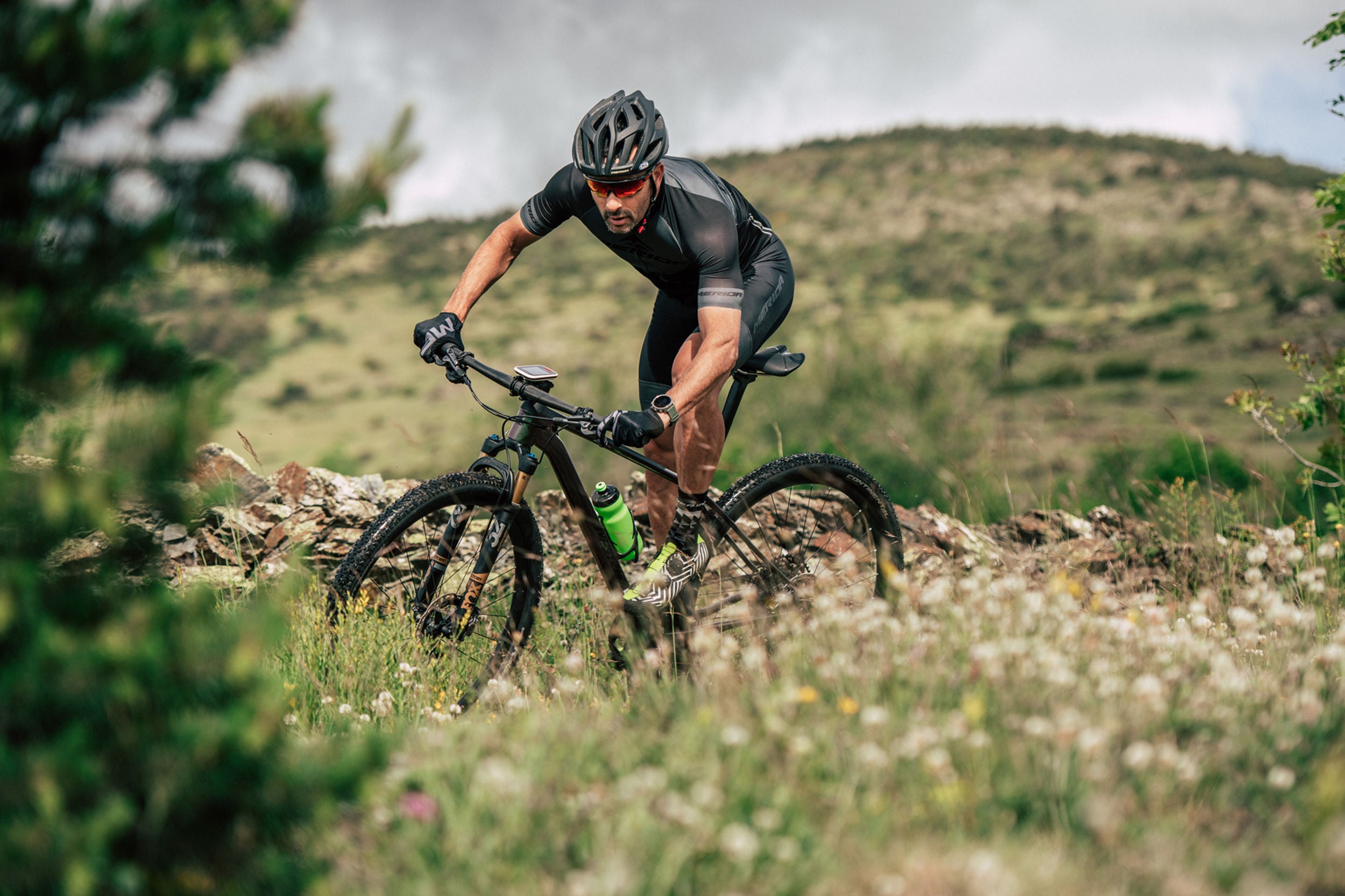 A picture of someone riding a Merida mountain bike