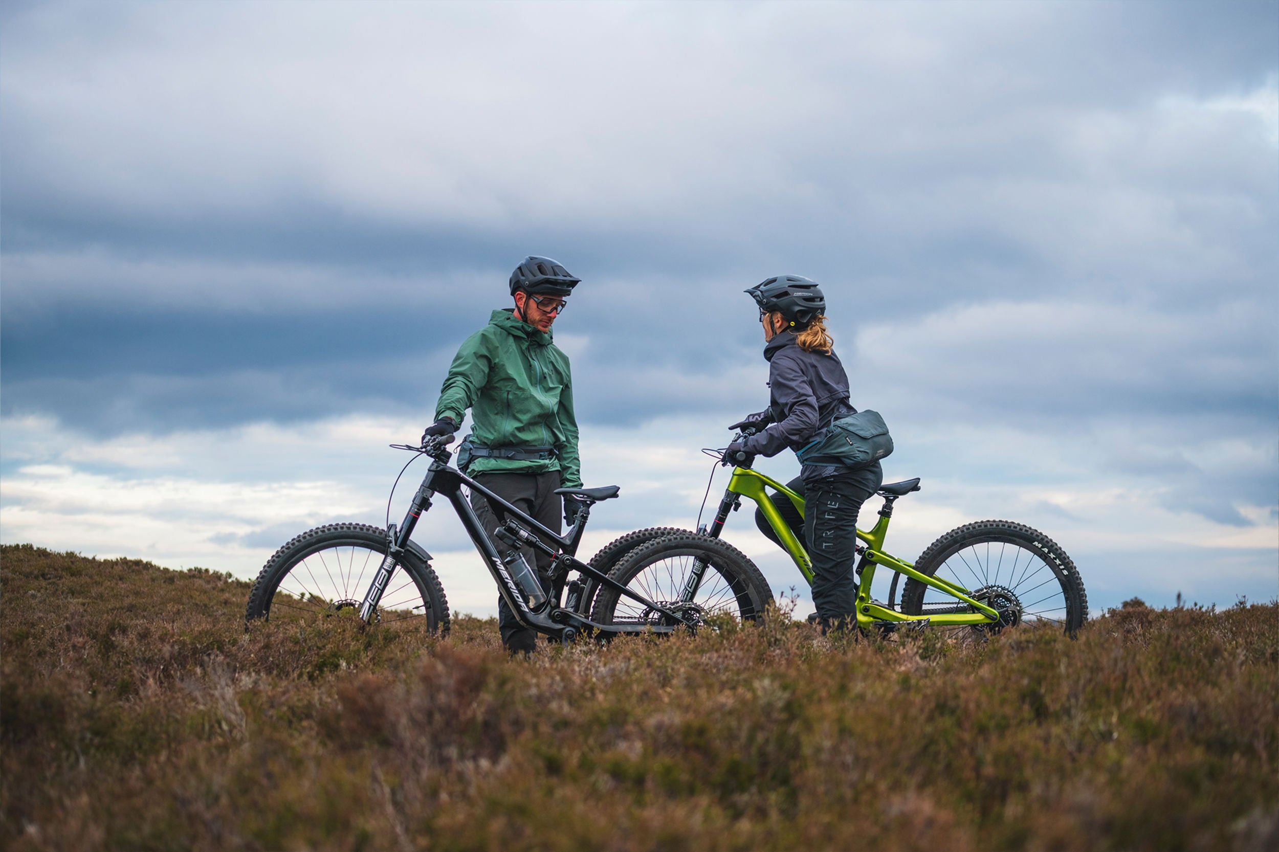 A picture of two people on Merida Mountain bikes