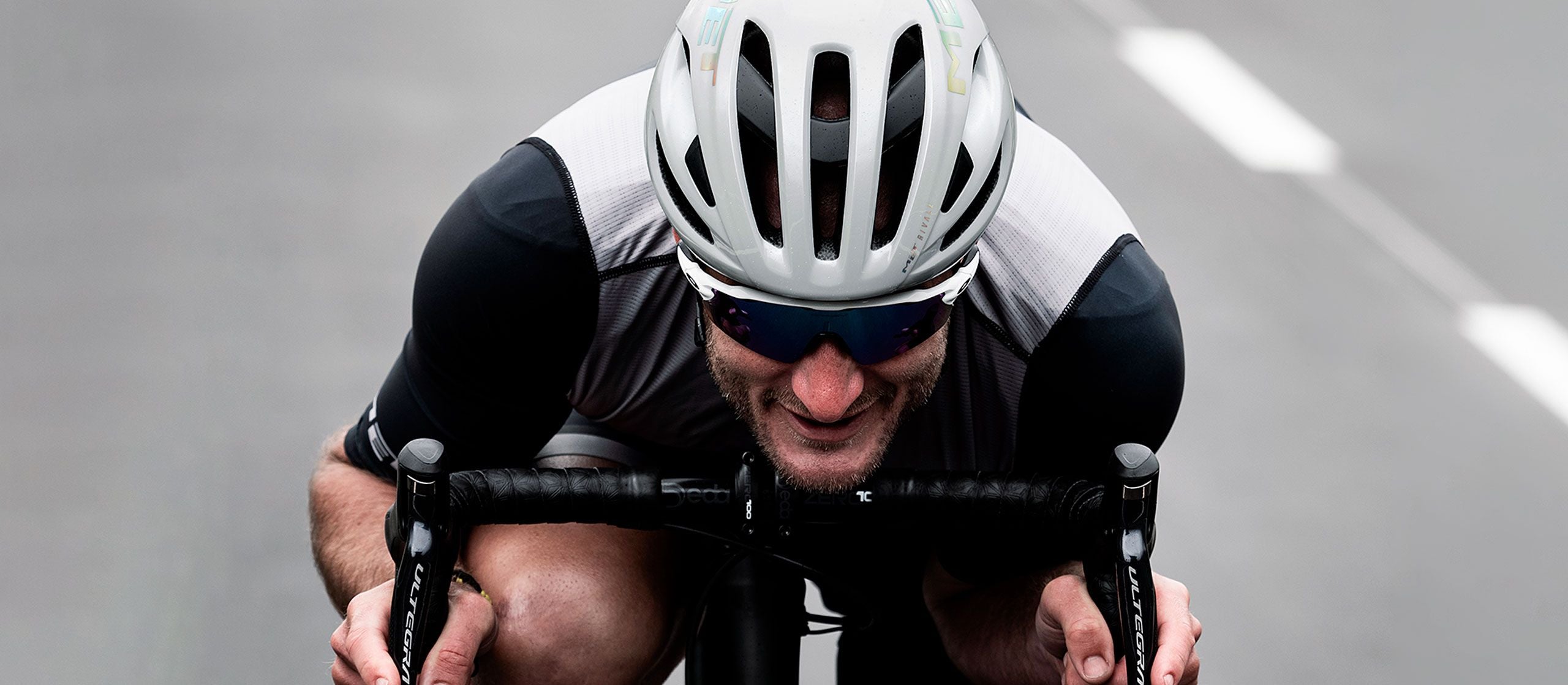 A picture of a road cyclist wearing the Met Rivale II MIPS Road Helmet