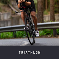 A picture of a guy riding a TT Bike wearing the Northwave Tribute 2 Triathlon Road Shoes