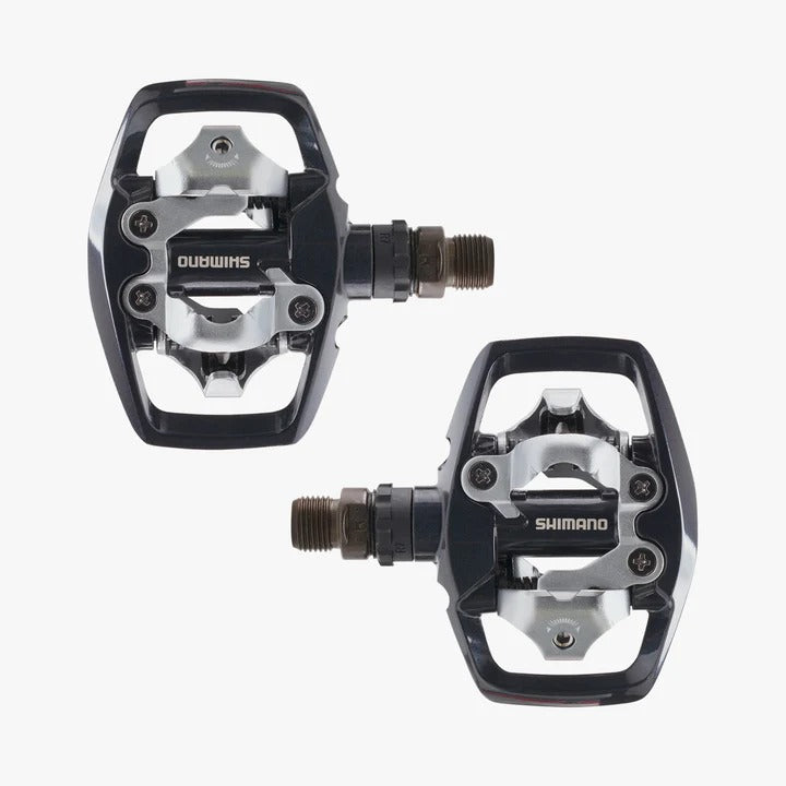 A pair of Shimano bicycle pedals on a white background