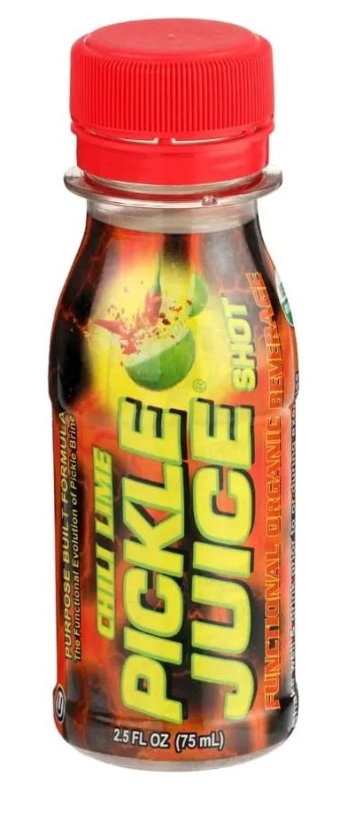 Bottle of chilli lime pickle juice shot with red cap on white background