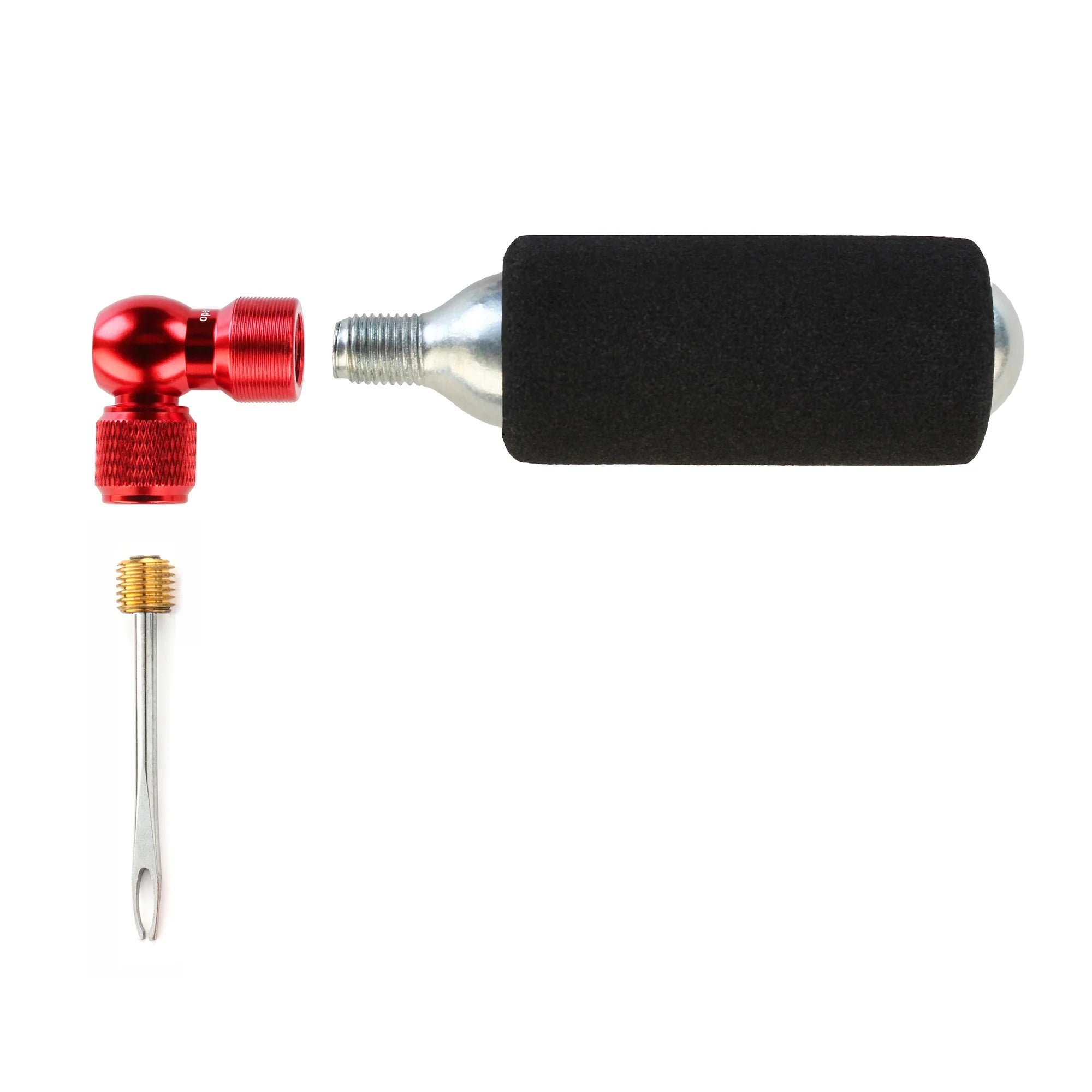 A bicycle pump set with a red anodized 90-degree elbow, a black foam handlebar grip, a silver metal valve, and a small brass key tool, all arranged on a plain white background.
