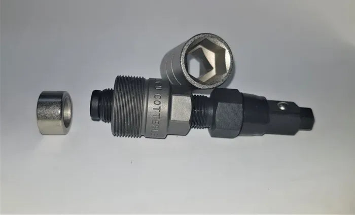 A bicycle crank extractor tool on a gray background