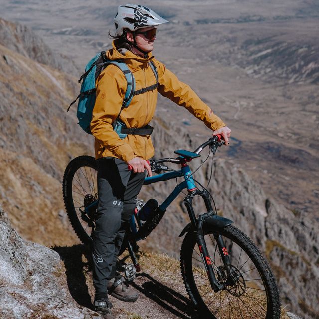 Person on a mountain bike in a desert landscape