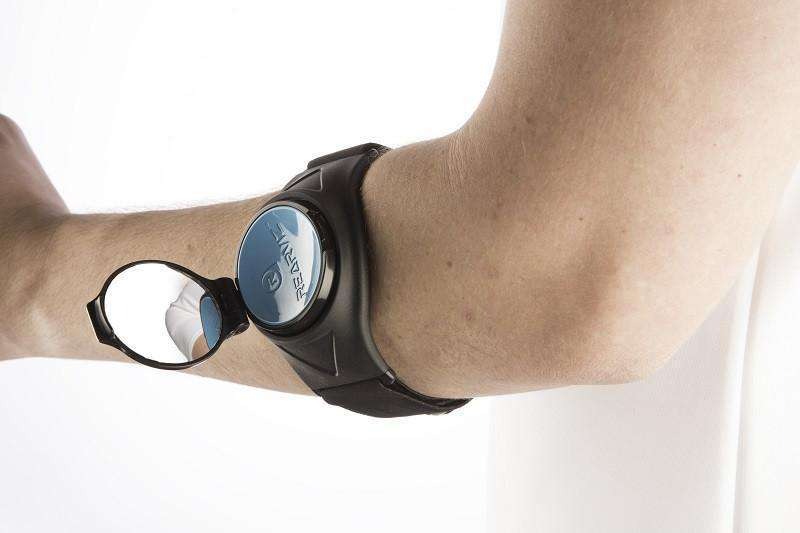 Bicycle mirror attached to someone's arm against a white background