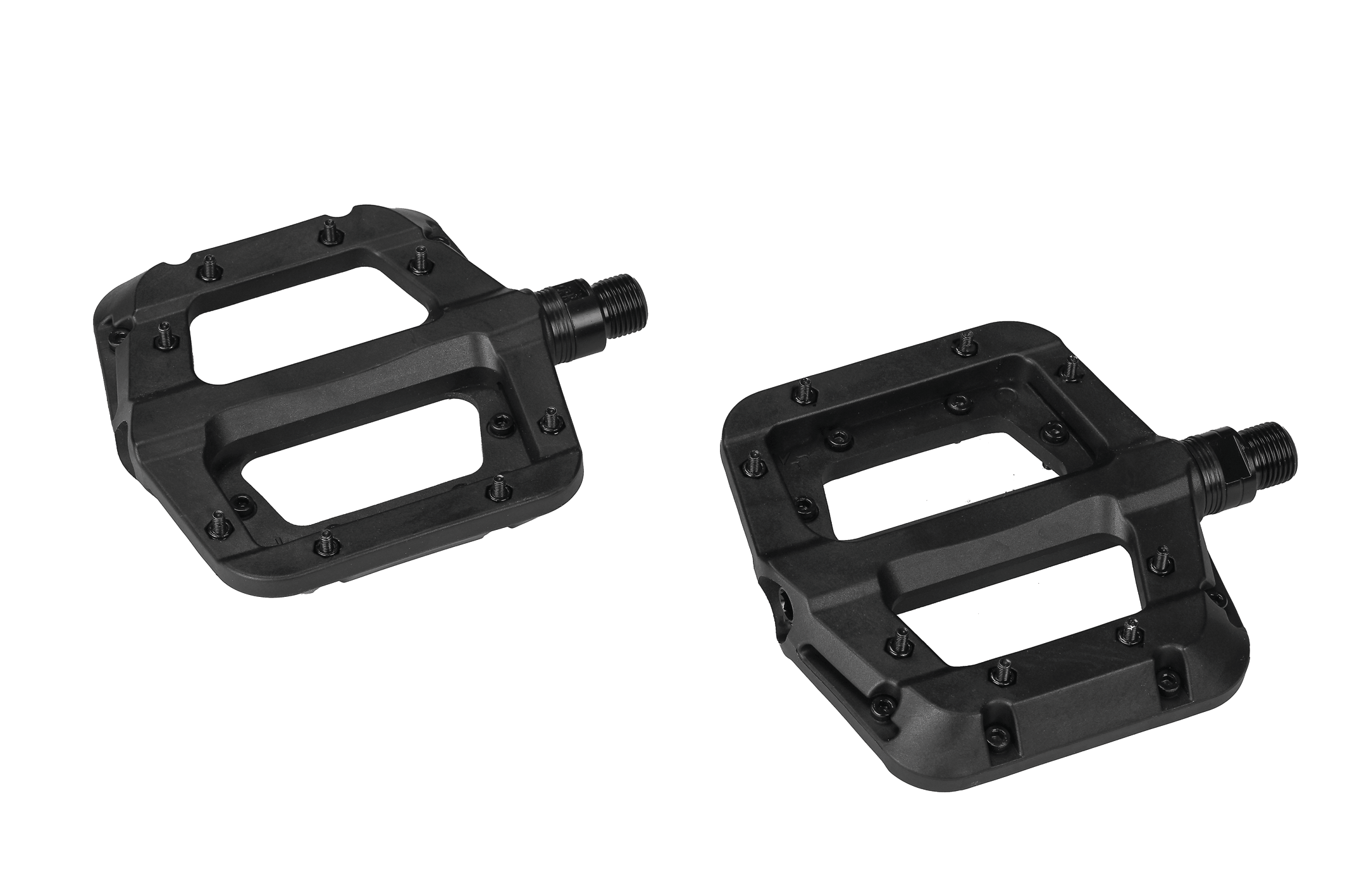 A set of black platform mountain bike pedals with pins on a white background