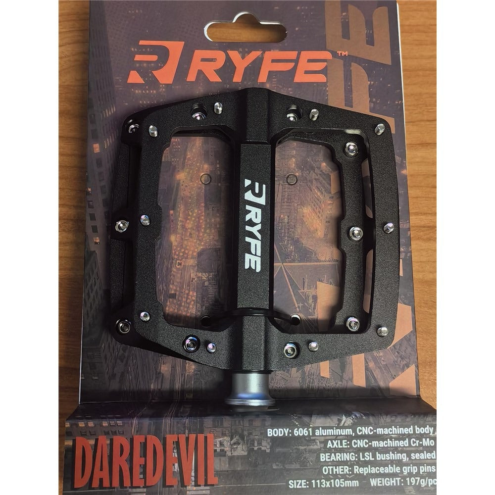 Ryfe Daredevil bike pedal packaging on a wooden surface