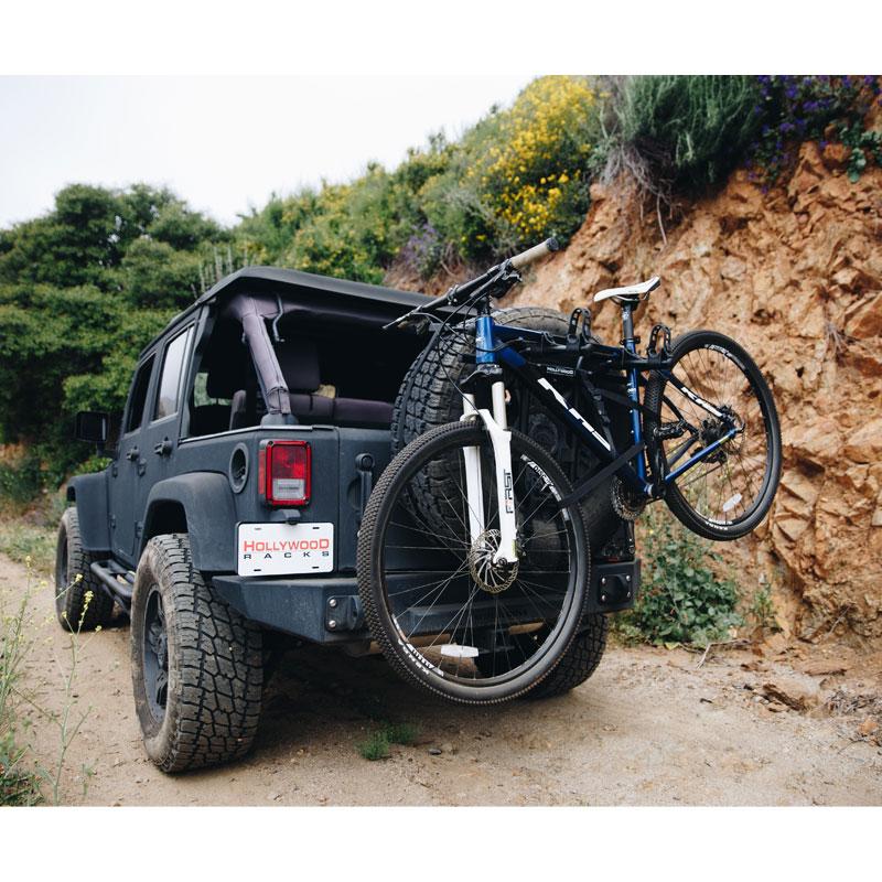 A picture of the Hollywood Spare Tyre Bike Rack attached to a spare wheel on a car with a bike mounted in it.