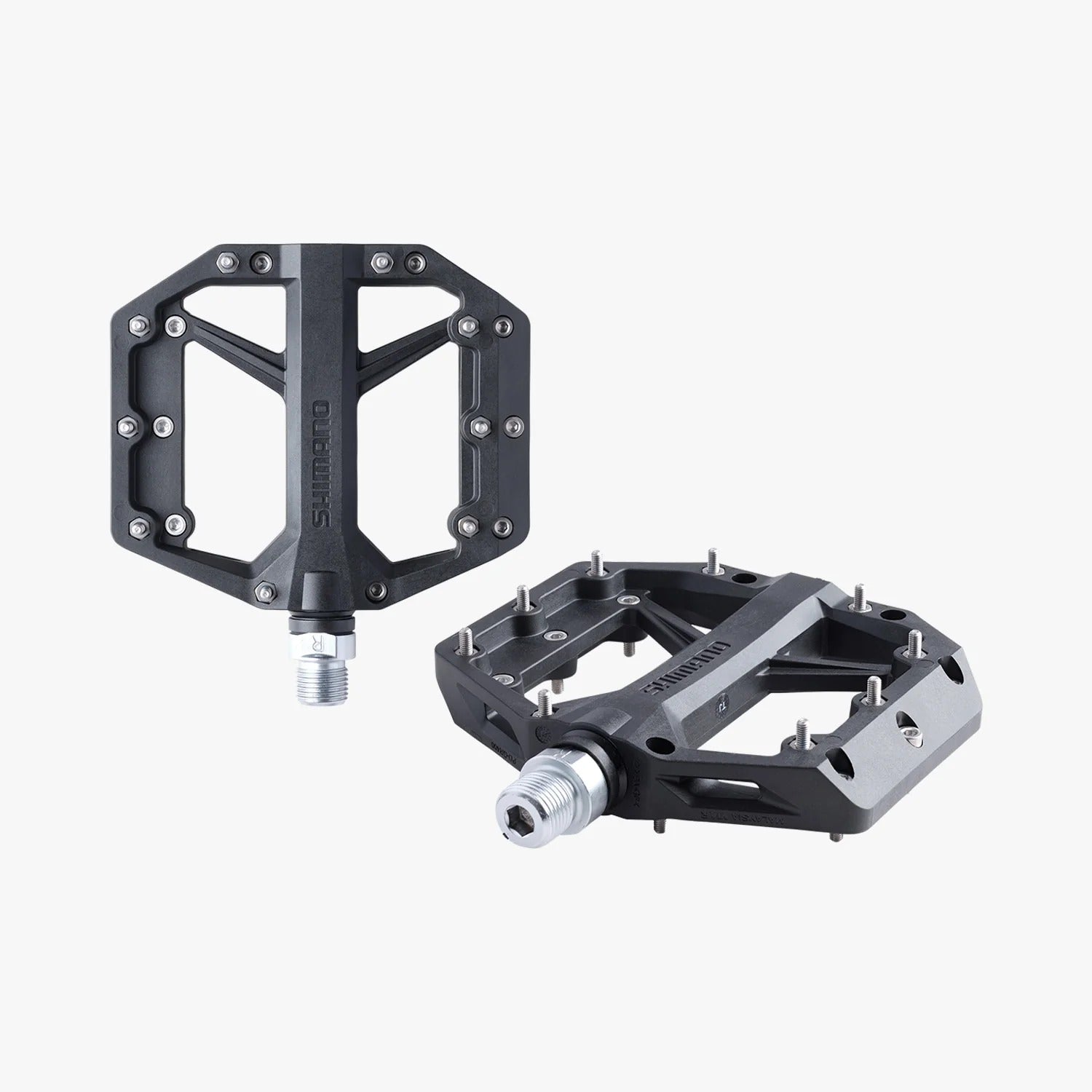 Two black bicycle pedals on a white background