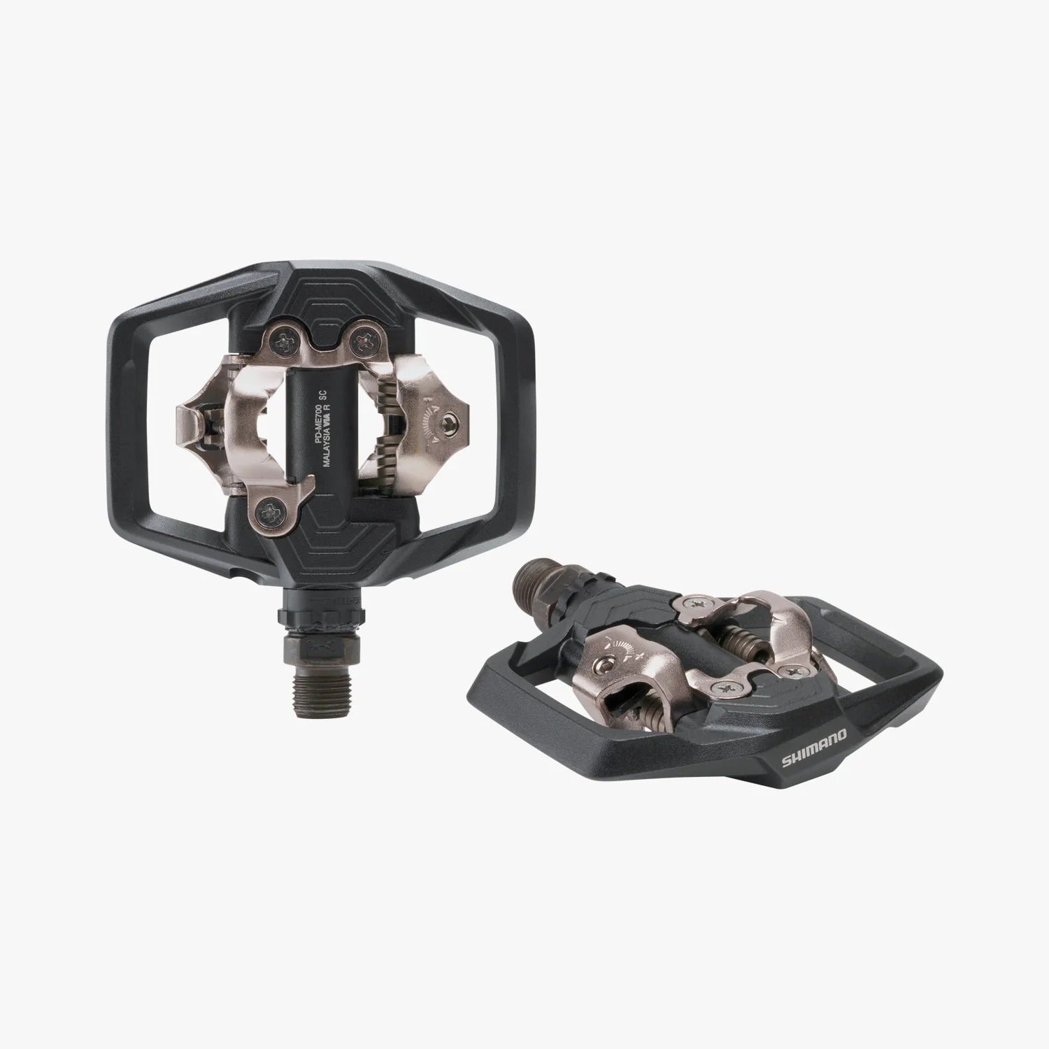 Pair of black bicycle clip in pedals on a white background