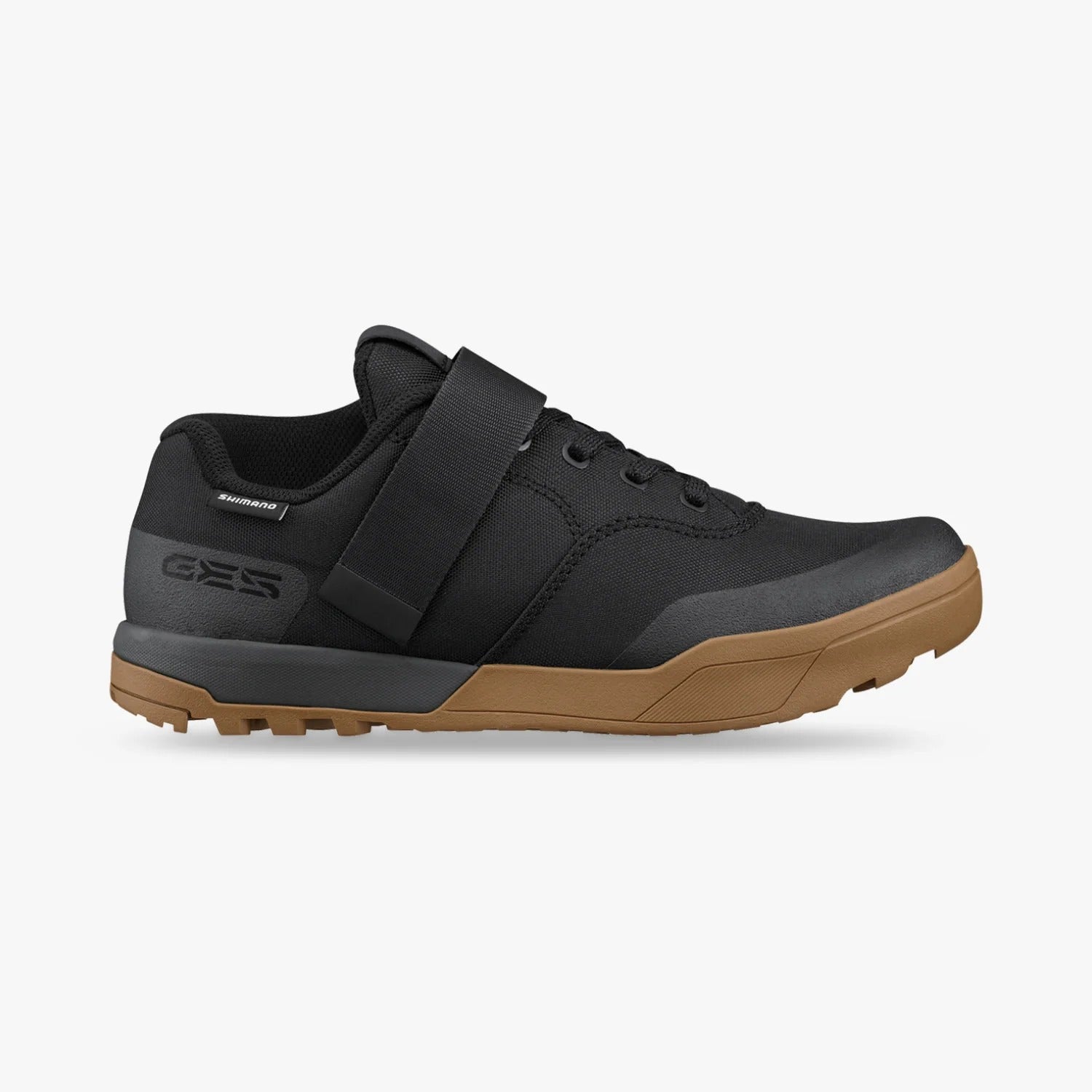 Black and brown mountain bike shoe on a white background