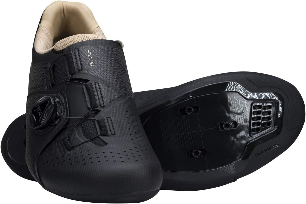 Black Shimano cycling shoes with a white background