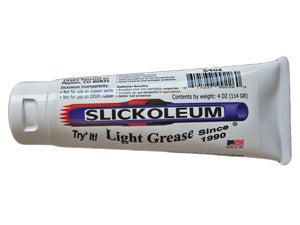 A tube of Slickoleum Grease against a white background