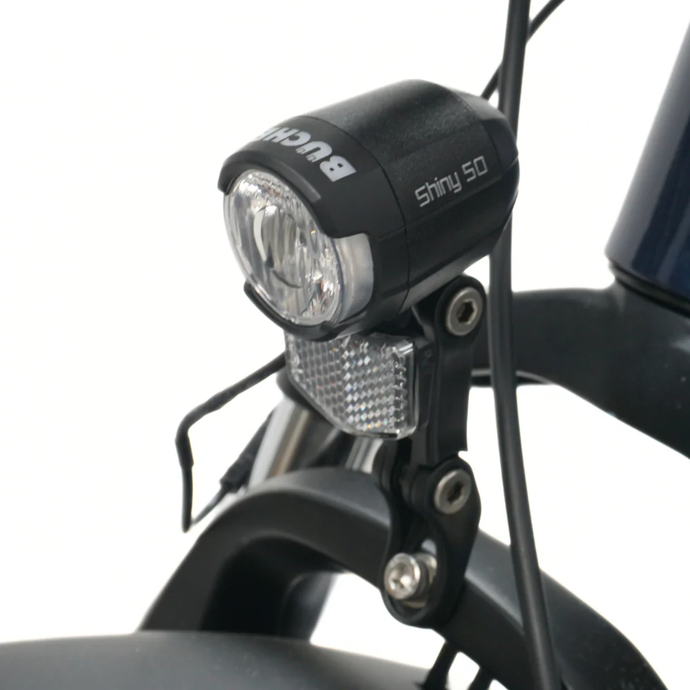 Close up of the front fork of a Bicycle showing the front light on a white background