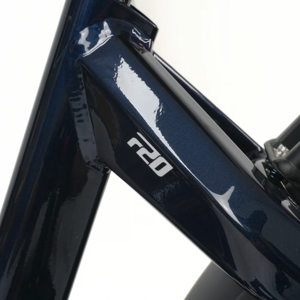 Close up fo the rear seat triangle on a navy blue bicycle