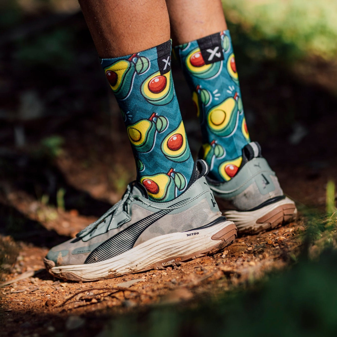 A picture of a man wearing the Sox Avocado Cycling Socks