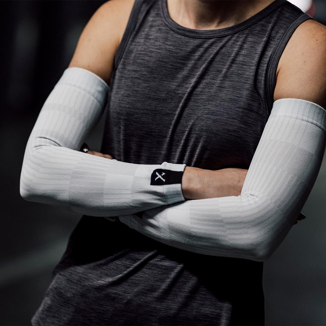 A picture of a woman wearing the Sox Slight White Arm Sleeves