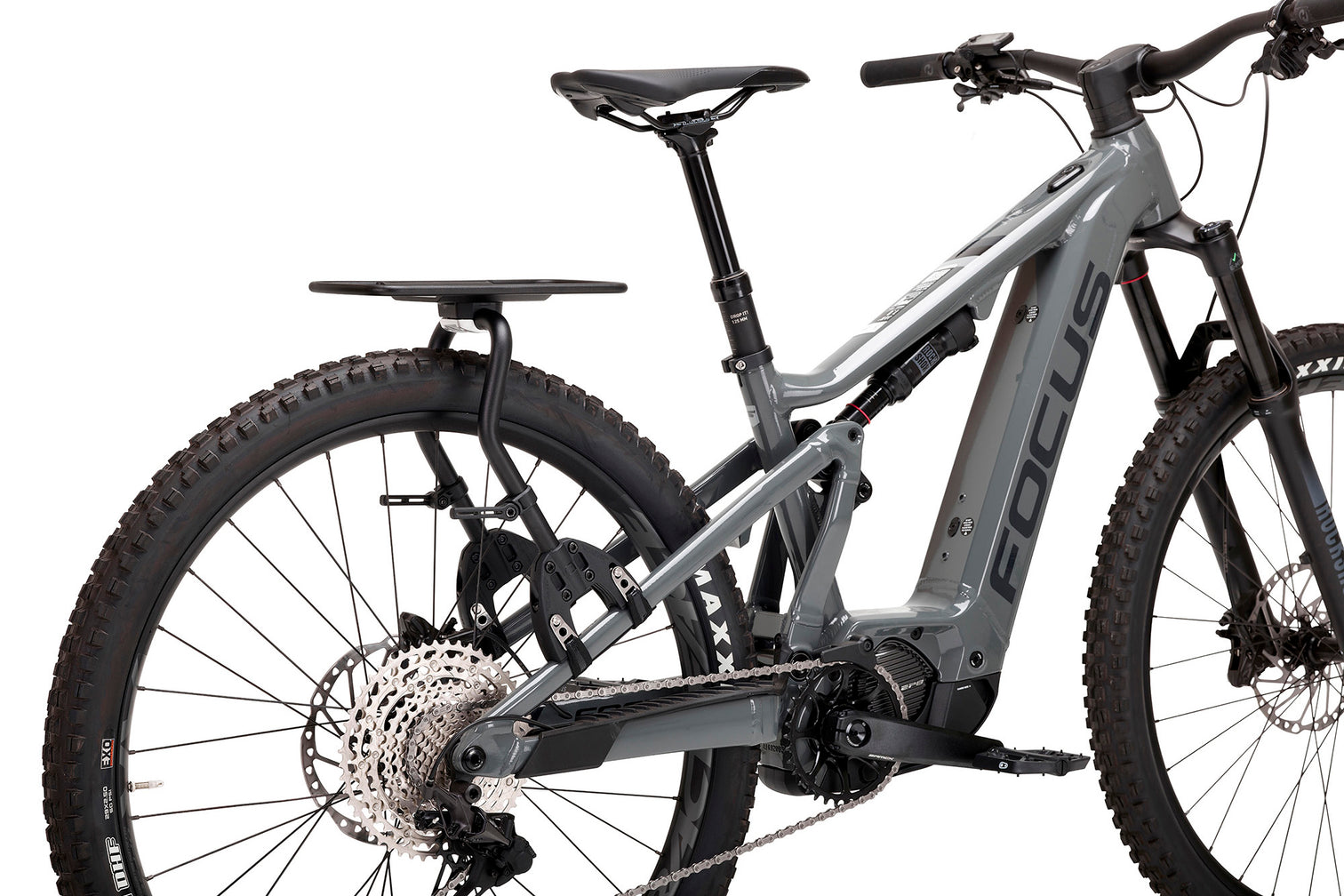 A picture of the Aeroe Pannier Rack attached to the back of a dual suspension electric mountain bike