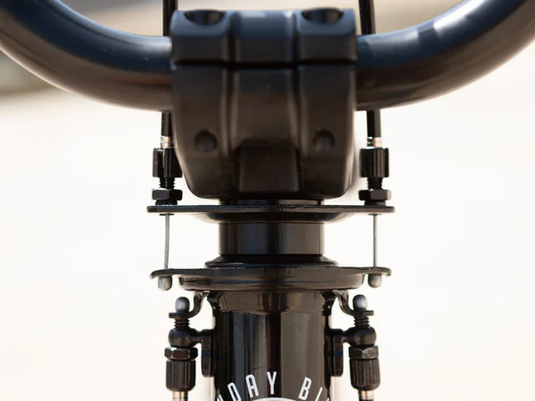 Close-up of a BMX Bike Giro system on the handlebar and front  fork with 'Sunday Bike' branding.