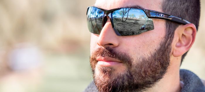 A picture of a man wearing the gloss black Tifosi Centus Cycling Sunglasses