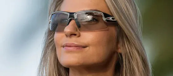 Woman wearing sunglasses with a blurred natural background