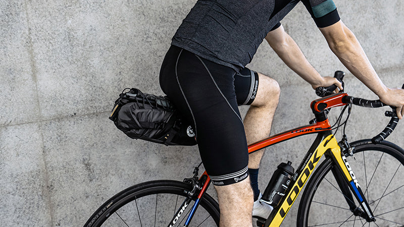 A picture a man on a bike with the Ulac Radtail GT Pro Saddle Bag 8.8 Litres attatched to back of road bike