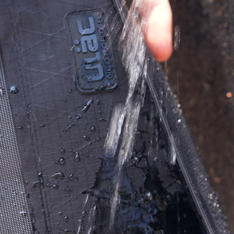 A picture of water spraying on the Ulac Touring Max 3.5 Litre Bicycle Frame Bag