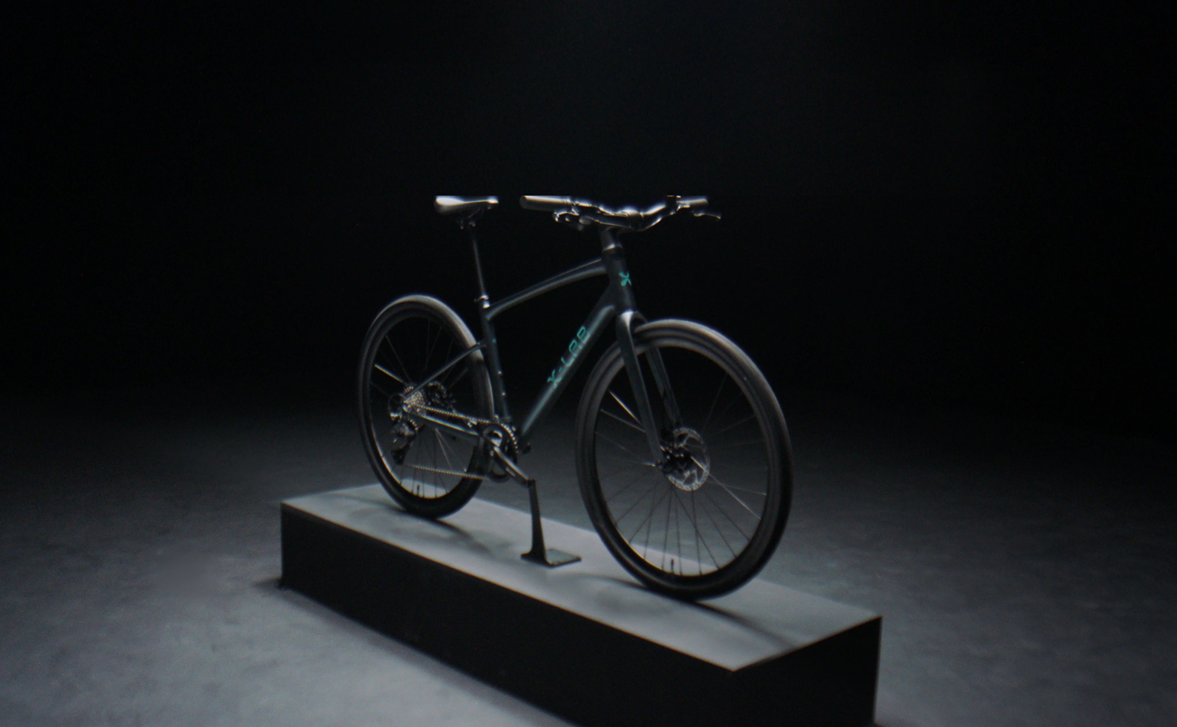 X-LAB Hybrid Bicycle on a dark platform with a black background