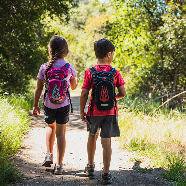 A picture of two kids wearing the Camelbak Mini M.U.L.E. 1.5 Litre packs