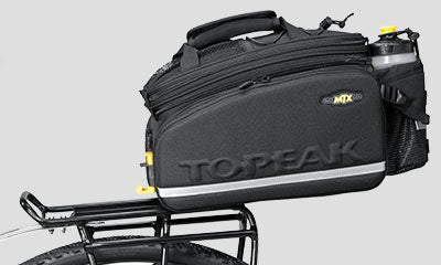 A picture of the Topeak Uni Super Tourist DX (Disc) 24-29" Pannier Rack with a bag attached