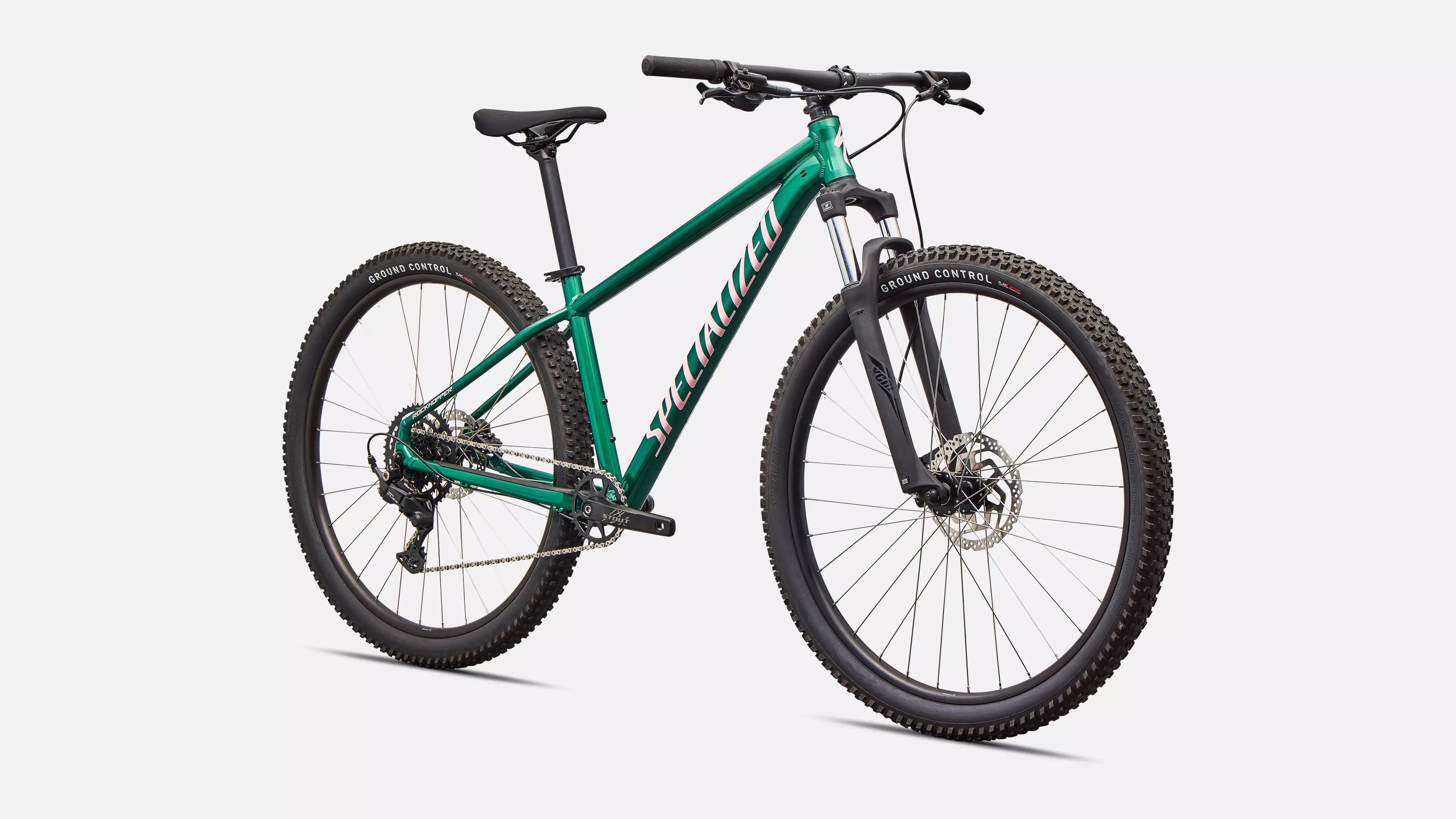 Green Specialized mountain bike on a white background