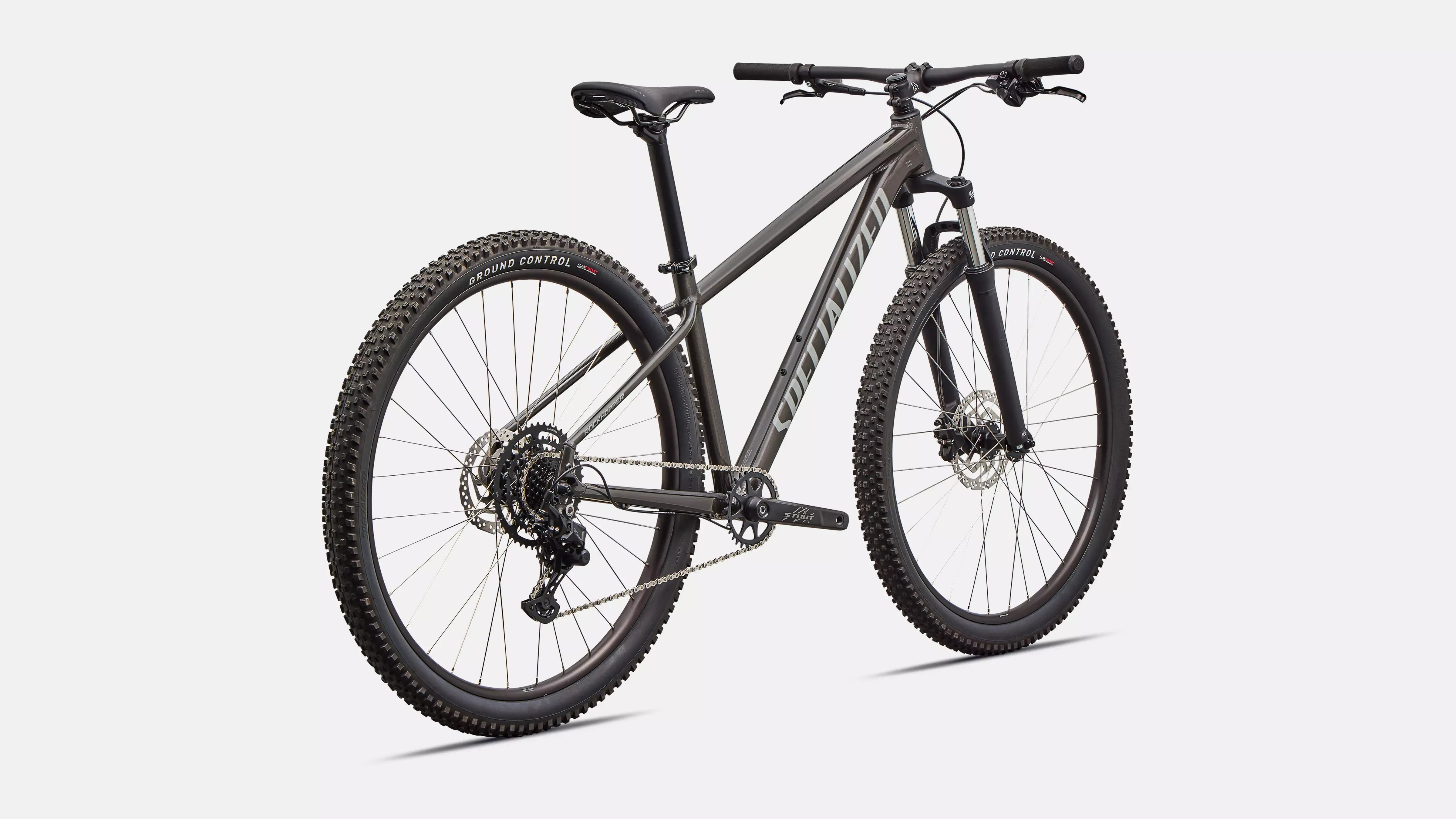 Dark grey Specialized mountain bike on a white background