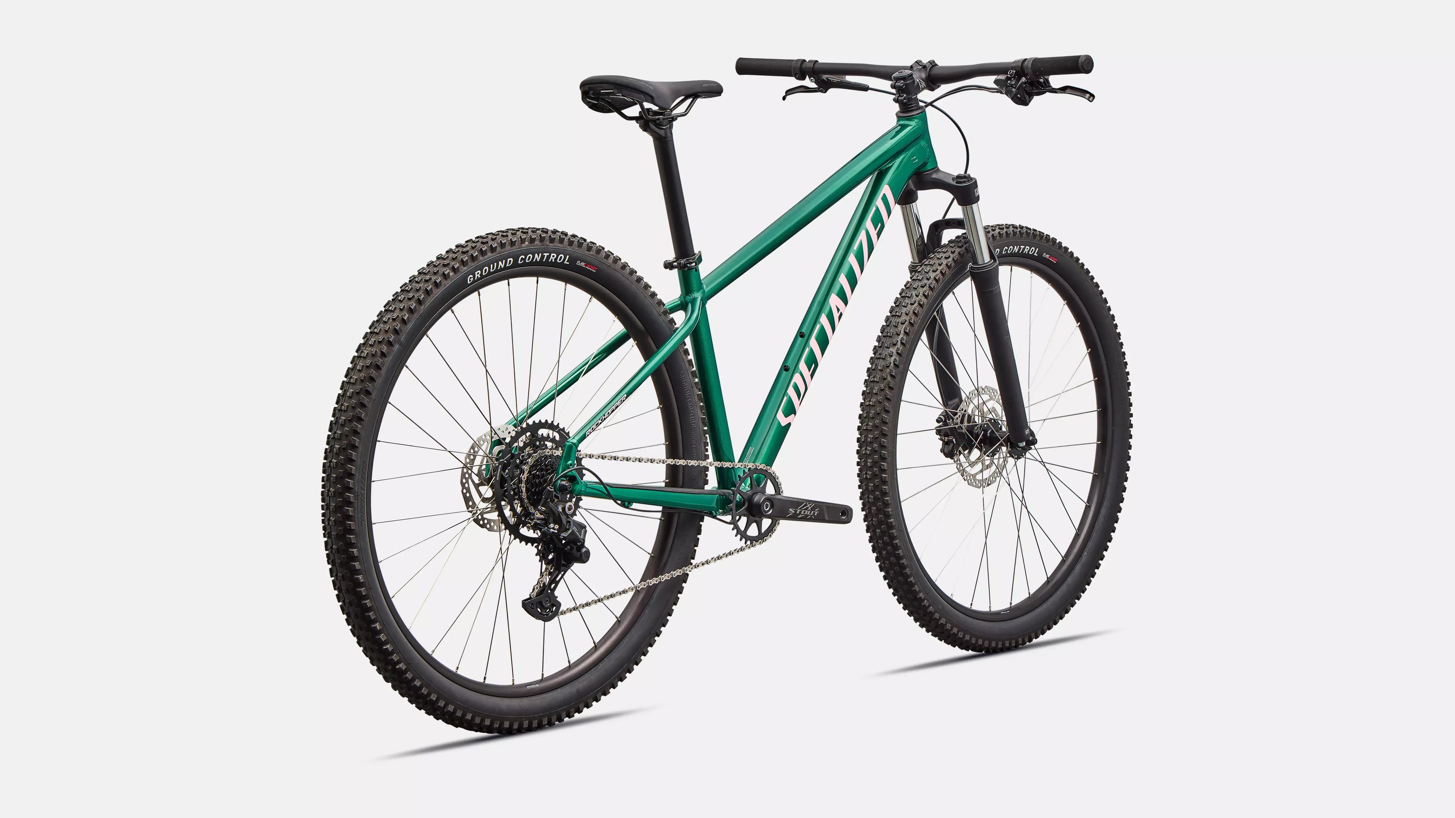 Green Specialized mountain bike on a white background