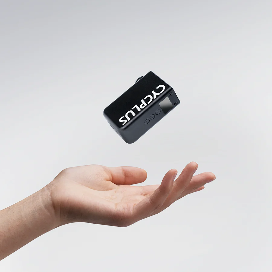 Black device with 'CYCLUS' branding levitating above a hand on a light gray background