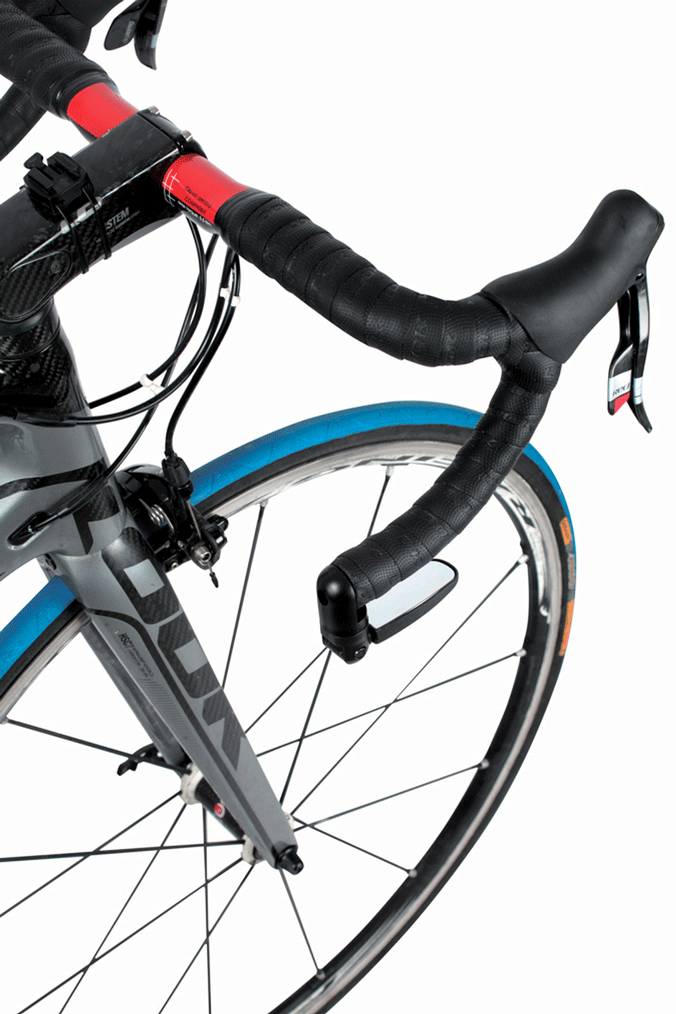 Close-up of a road bike handlebar with a mirror tucked underneath the drop bar against a white background