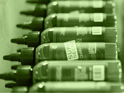 A row of Silca Super Secret Chain Lube lying horizontally 