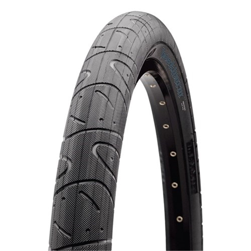 Bicycle tyre with tread pattern on a white background