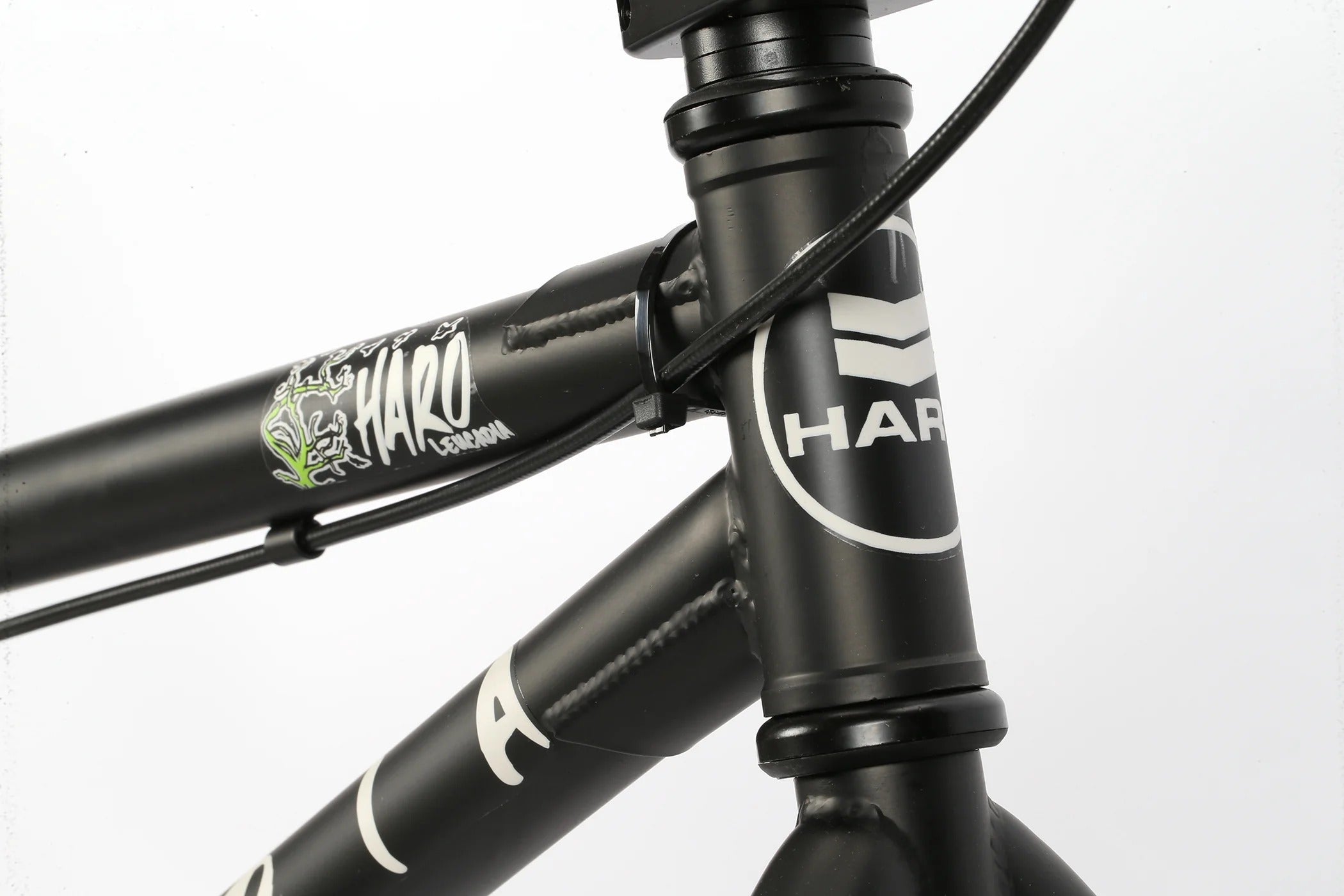 Close-up of a black BMX bicycle frame with Haro branding on a white background